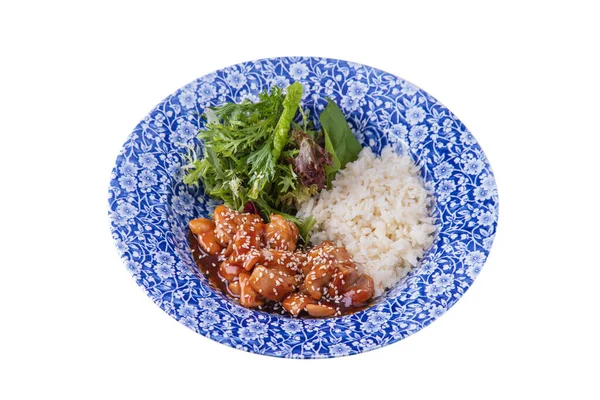 Meat in sauce with sesame seeds, rice, arugula, endive, salad, parsley in a plate on a white plate