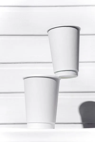 White Paper Cups Standing Top Each Other White Chair White — Stockfoto