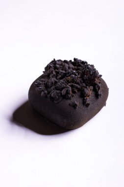 Chocolate dessert with chocolate chips on a white background