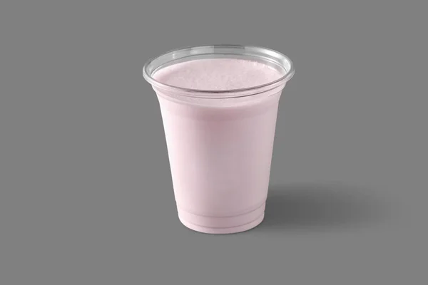 Milk Shake Strawberry Syrup Transparent Plastic Glass Glass Gray Background — Stok fotoğraf