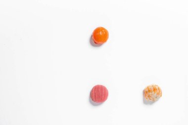 Sashimi bowls. Three balls of sashimi lie on a white background. Tuna sashimi, salmon sashimi and shrimp sashimi.