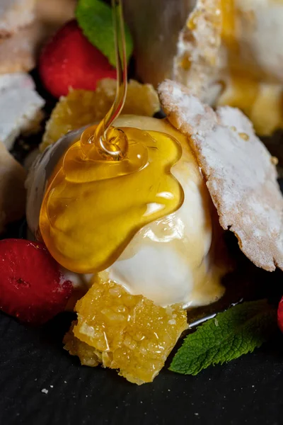 Ice Cream Balls Poured Honey Strawberries Orange Pastries Mint Plate — Foto Stock