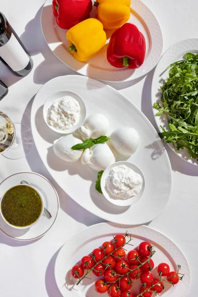 White Oval Plate Different Types Mozzarella Cheese Basil Leaves Nearby — Stock Photo, Image