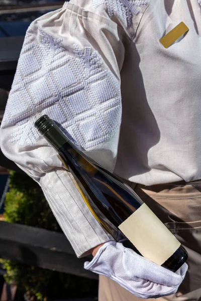 Girl Waiter Uniform Holds Bottle Wine Her Hand — Foto de Stock