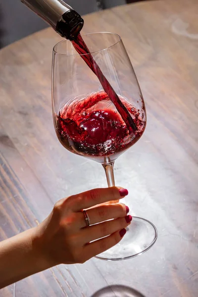 Girl Pours Wine Bottle Glass Background Table — Foto de Stock