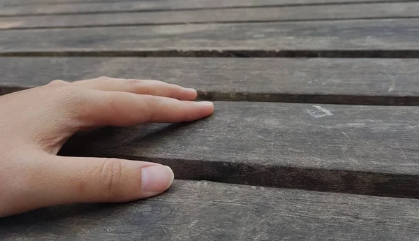 Hand Holding Wooden Sign Concrete Background — Φωτογραφία Αρχείου