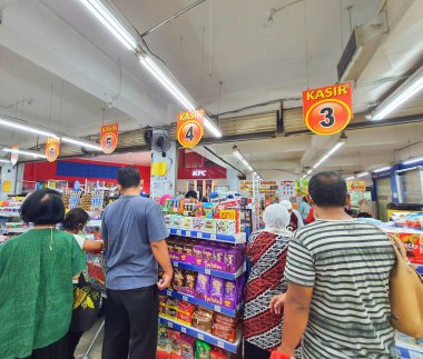 Jakarta, Indonesia in July 2022. People are waiting in line at the cashier of a supermarket to pay for the necessities they bought.