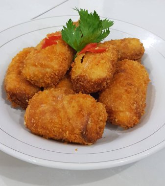 Risoles, vegetable ragout wrapped in flour and fried.