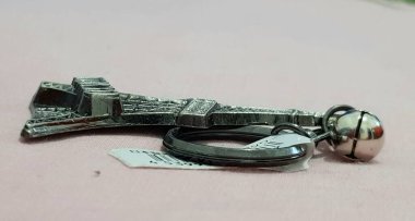 Souvenir from Singapore, a key ring made of silver steel.