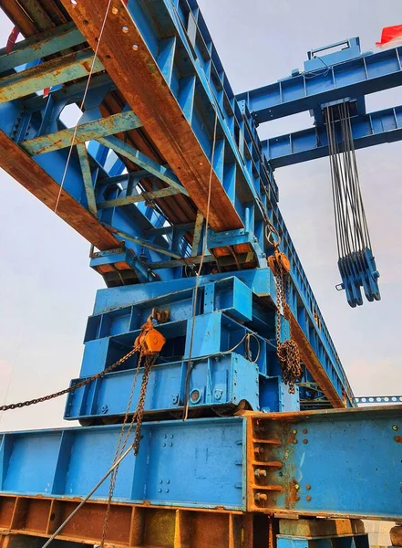 This is a photo of the steel structure of a launcher gantry that will be used for erection precast concrete I Girder (PCI Girder) across the river . This yellow gantry launcher comes from Indonesia with a capacity of up to 365 tons, with a maximum la