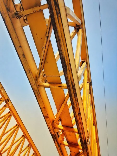 This is the steel structure of a launcher gantry that will be used for erection precast concrete I Girder (PCI Girder) across the river . This yellow gantry launcher comes from China with a capacity of up to 140 tons, with a maximum launch speed of 4