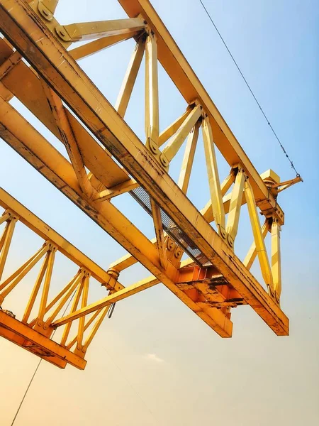 This is the steel structure of a launcher gantry that will be used for erection precast concrete I Girder (PCI Girder) across the river . This yellow gantry launcher comes from China with a capacity of up to 140 tons, with a maximum launch speed of 4
