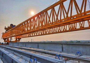 This is the steel structure of a launcher gantry that will be used for erection precast concrete I Girder (PCI Girder) across the river . This yellow gantry launcher comes from China with a capacity of up to 140 tons, with a maximum launch speed of 4