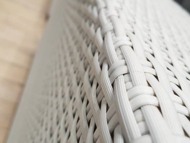 Close up photo of white artificial rattan wicker. Used for chairs.