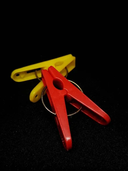 Isolated Photo Clothespins Red Yellow Very Contrasting Colors Black Background — 图库照片