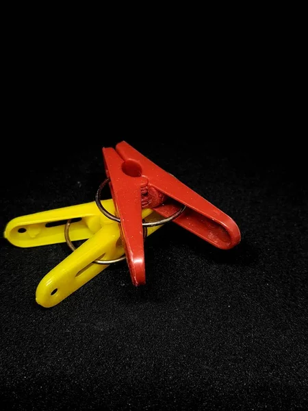 Isolated Photo Clothespins Red Yellow Very Contrasting Colors Black Background — Foto de Stock