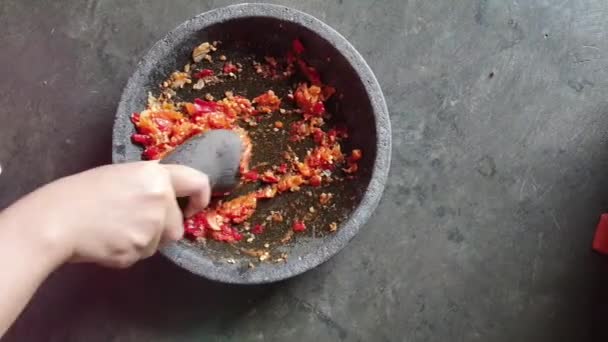 Process Making Chili Sauce Hand Pulverizing Onions Chilies Pestle Stone — Stock Video