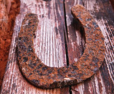 Close-up of an old rusty lucky horseshoe