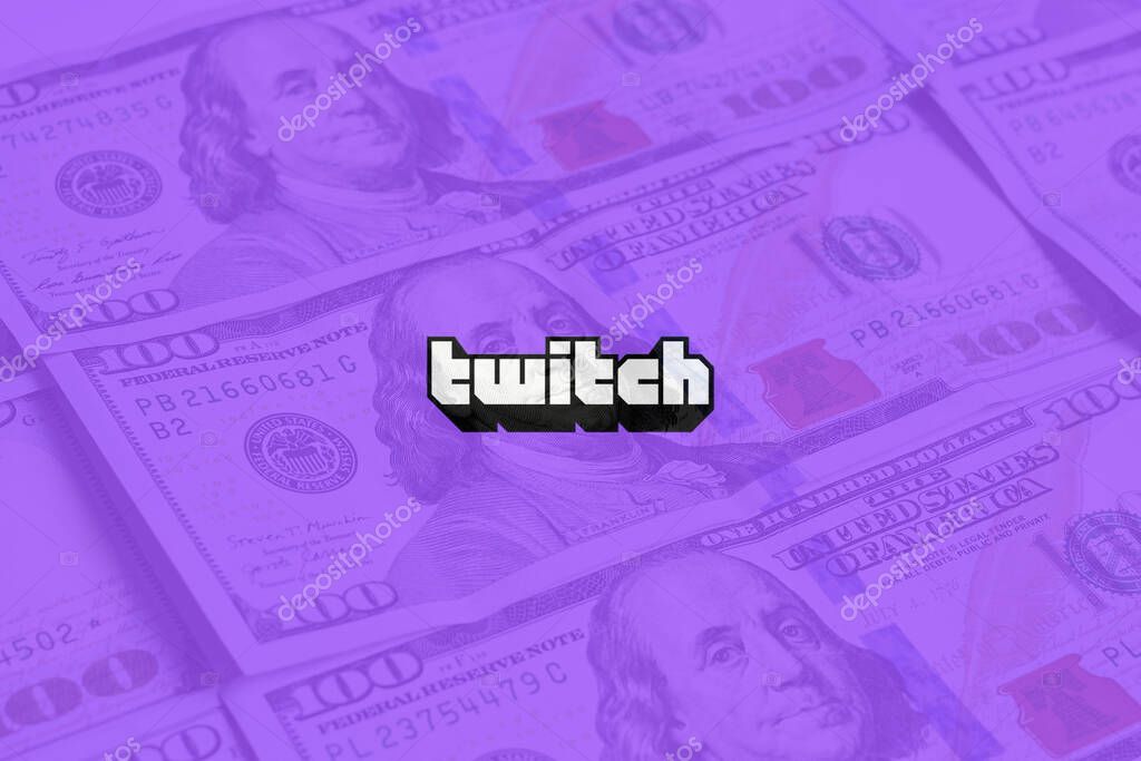 Tashkent, Uzbekistan - 13 October 2021: Twitch logo over pile of US dollar banknotes. Symbol of subscription payment for using Twitch.tv services, or earning money on video streaming