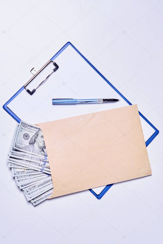 Empty document and pile of money in the envelope