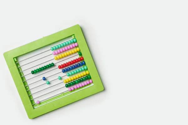 Разноцветный калькулятор на белом — стоковое фото