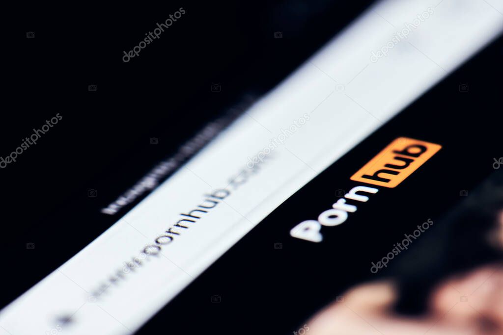 California, United States - 25 November 2021: Pornhub - worlds leading free porn site. Pornhub logo on the mobile phone screen. Porn addiction. User browsing Pornhub.com on smartphone