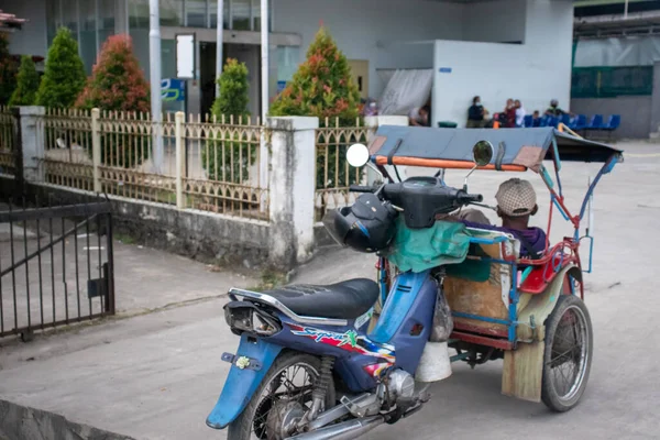 Banyuasin, Indonesia - August, 01, 2022: This public transportation is called a pedicab, this public transportation is often found in Southeast Asia, including Indonesia
