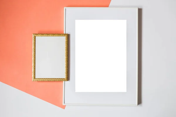 White picture frame with decorations. Mock up for your photo or text. Place your work, print art, white background, pastel color book. Photo realistic 3d illustration. Orange and white background