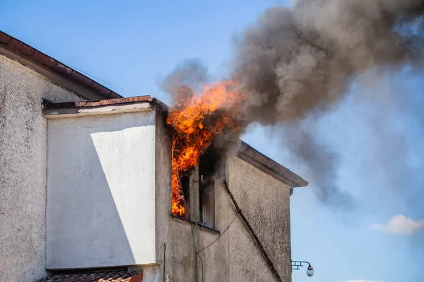 Fire Fighters Putting Out A House Fire