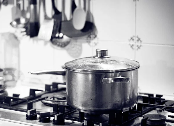 Casserole on the fire of a gas stove in the kitchen