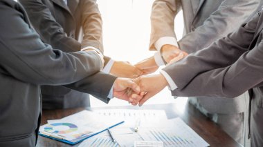 Close-up of group hand success business people person working together in office. Diversity of businessman and businesswoman attending corporate meetings. concept of friendship, cooperation corporate.