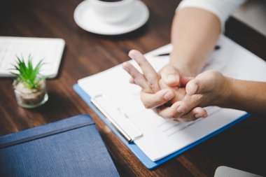 Arthritis person, finger woman ache from working in office. Concept office syndrome hand pain from occupational disease, woman having wrist pain from using laptop computer, wrist pain.