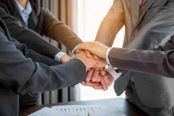 Close-up of group hand success business people person working together in office. Diversity of businessman and businesswoman attending corporate meetings. concept of friendship, cooperation corporate.