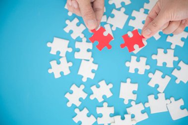 Human hands holding red jigsaw with word problem solution. symbol of association and connection. business strategy.