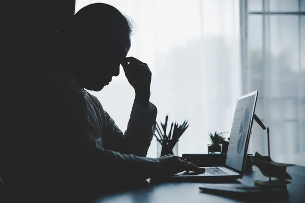 Stress business woman person from hard work, depression in office. Tired and anxious employee female with unhappy at problem job. young businesswoman sitting sad front of laptop computer on desk.