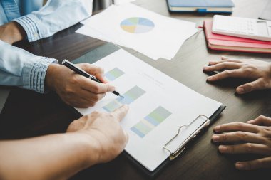 Business group collaboration discussing work analysis with document financial data and marketing growth report graph in team, presentation and brainstorming to strategy plan making profit of company.