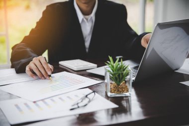 Businessman looking at charts, spreadsheets, graph financial development, bank accounts, statistics, economy, data analysis, investment analysis, stock exchange