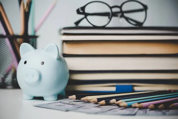 close-up education object with stack money coin-cash dollar and glass jar on background. Concept to saving money income for study, Calculating student finance costs and investment budget loan