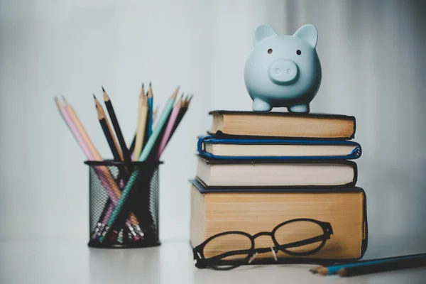 close-up education object with stack money coin-cash dollar and glass jar on background. Concept to saving money income for study, Calculating student finance costs and investment budget loan