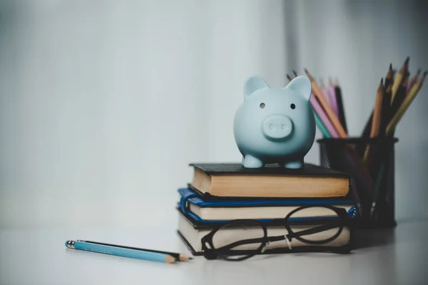 close-up education object with stack money coin-cash dollar and glass jar on background. Concept to saving money income for study, Calculating student finance costs and investment budget loan