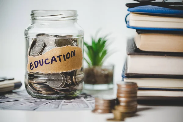 close-up education object with stack money coin-cash dollar and glass jar on background. Concept to saving money income for study, Calculating student finance costs and investment budget loan