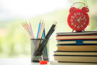 Object education green nature background with stack of ancient books or old bible, open paper book on wooden table with copy space. concept of back to school, research study