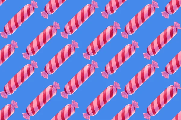 Seamless pink candy pattern isolated on the blue background. Decorative element and gift wrapping paper.