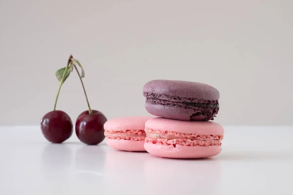 Close Appetizing Macarons Red Cherries White Background Mix Appetizing Macarons — Stock Photo, Image