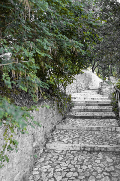 Beautiful cobblestone steps up, beautiful stairs up, stairs surrounded by trees, scenic view up, road to heaven, beautiful landscape in Italy, place for your text, background for quotes