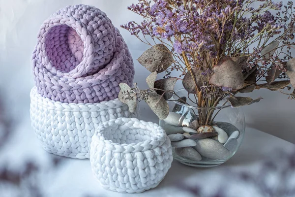 Purple cute decorative hand crocheted baskets, sustainable handicraft business, cozy home atmosphere with decorative purple dry  plants and white background