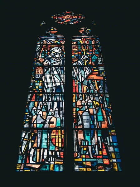 The view of a colorful stained glass window of the Church of St Peter and St Paul in Ostend, Belgium.