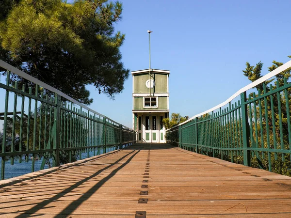 A historical wooden elevator of an old yacht clubhouse from the 1920s with a seagull on its flagpole. The elevator is located in Buyukada, which is the largest island among Princes' Islands in Istanbul.