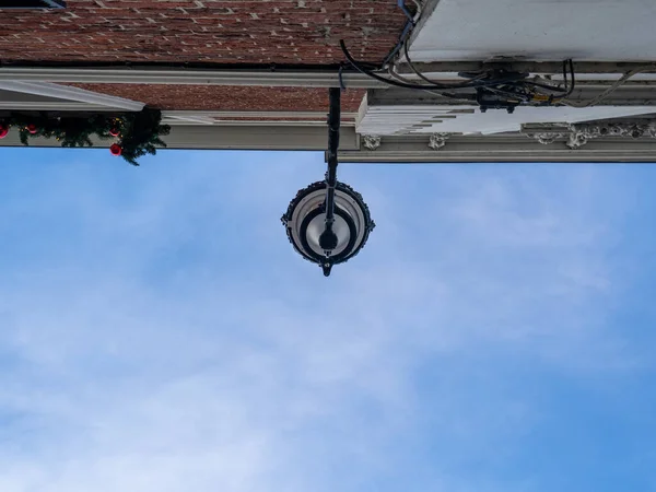 Bottom-up shot of a street lamp in Bruges in Belgium.
