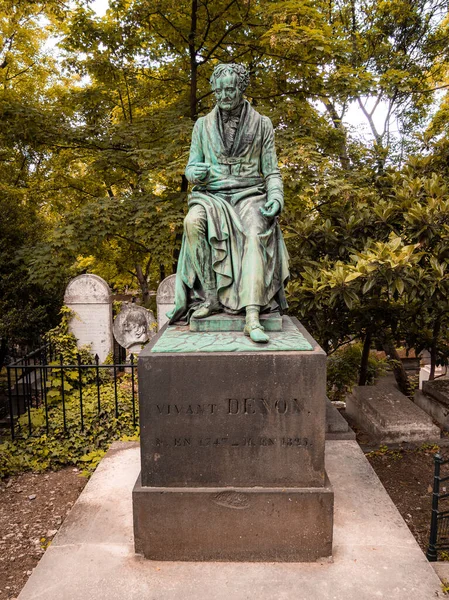 Statue on the grave of Vivant Denon in the famous Pere Lachaise cemetery in Paris, France. The cemetery is a tourist destination since many famous people sleep there.